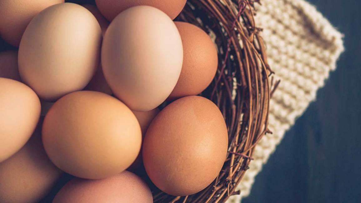 a basket of brown eggs